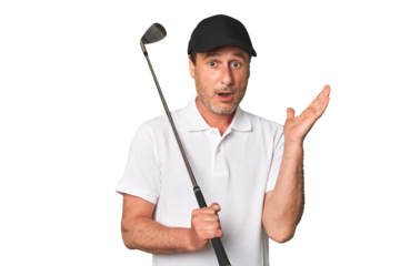 Middle aged golfer man surprised and shocked.