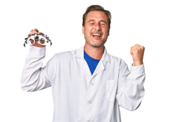 A middle-aged optometrist man raising fist after a victory, winner concept.