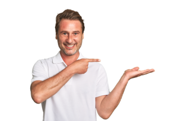 A middle-aged man isolated excited holding a copy space on palm.