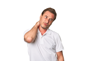 A middle-aged man isolated touching back of head, thinking and making a choice.