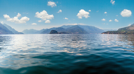 Lake Como (Italy) summer coast hazy view from ship board.