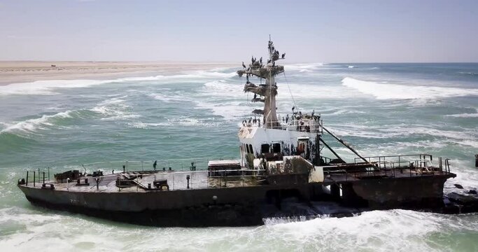 4K Aerial drone footage of an Abandoned Shipwreck Zeila on Famous Skeleton Coast, Namibia. Namibian Atlantic coastline, Zeila L-758 Walvis Bay stranded rusty ship at sand beach in Skeleton Coast Park