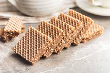 Sweet chocolate wafer on kitchen table.