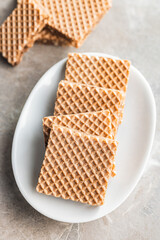 Sweet chocolate wafer on plate.