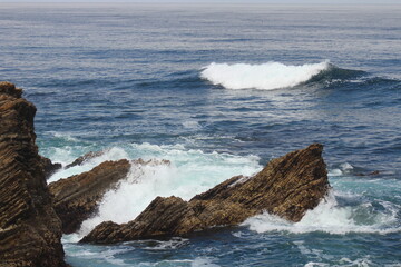 waves crashing on rocks