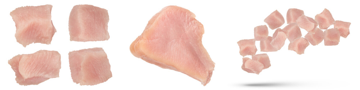 Turkish meat. Fresh set of fillet pieces and pieces of turkey isolated on white background. Isolate cubes and pieces of juicy turkey meat for advertising banner or product label.