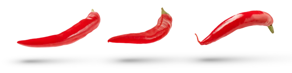 Photo sur Plexiglas Piments forts Pods of red hot peppers of various sizes and shapes fall on a white isolated background, casting a shadow. Fresh red pepper for insert in design or project, isolated on white, close up.