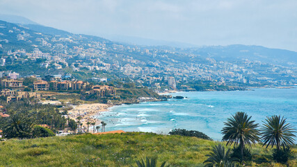 Splashing waves on Byblos beach. View of Jbeil Mediterranean coastline, Lebanon