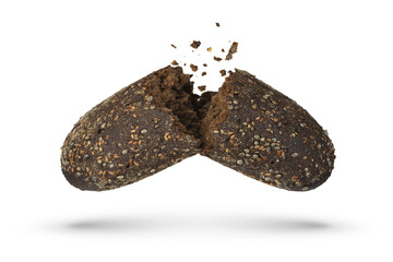 Loaf of black rye bread on a white isolated background. Failed breakfast concept. The bread is broken into 2 parts, crumbs are pouring out of it.