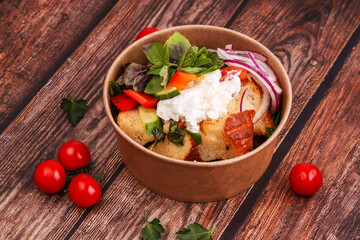 salad with ricotta bell pepper and italian bread on a wooden table with tomatoes 3