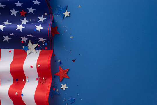 The fourth of july celebration concept. Above view photo empty space with red, white and blue confetti stars and american flag on blue isolated background with copy-space