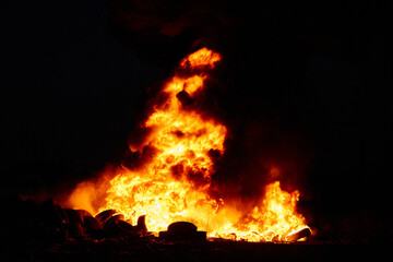 flames of fire at night, black smoke bright fire