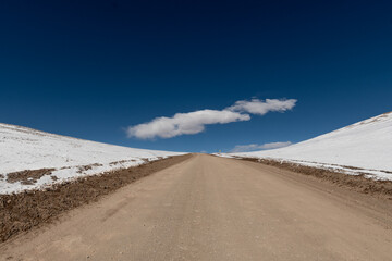 Road in the Andes Mountains, Argentina, at 4000 meters above sea level with snow-capped mountains and volcanoes. - obrazy, fototapety, plakaty