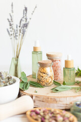 Botanical blends, herbs, essencial oils for naturopathy. Natural remedy, herbal medicine, blends for bath and tea on wooden table background