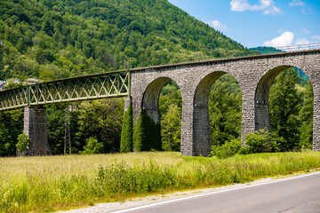 Fototapeta premium Beautiful, old railway in Soca valley, Slovenia, in Tolmin regio with famous arcs in wonderful, green, landscape