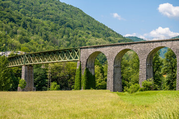 Fototapeta na wymiar Beautiful, old railway in Soca valley, Slovenia, in Tolmin region with famous arcs in wonderful, green, landscape