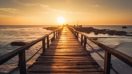 Rolgordijnen An pier stretching into the horizon, illuminated by golden sunlight © Milan