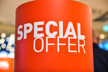 Special offer,  sign advertising price reductions and goods for sale in bright red and write fonts. 