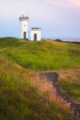Fototapeta na wymiar Scenic seascape landscape at sunset or sunrise of Elie Ness Lighthouse on the East Neuk Peninsula in coastal Fife, Scotland, UK.