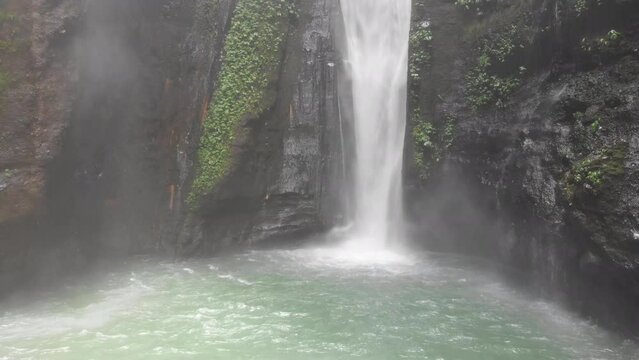 Aerial footage captured on DJI drone showing one of the largest waterfalls in Bali, Indonesia. Situated far north beyond Mount Batu one of the most isolated and densely vegetated areas on the island.