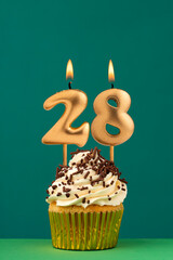 Birthday candle number 28 - Vertical anniversary card with green background