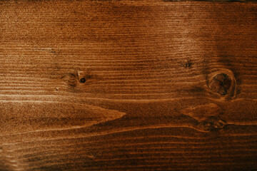Stained natural wood with shiny polish, Textured background photo