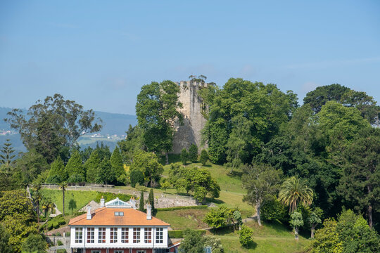 Soto del Barco, Asturias, Spain - 02 June, 2023. View with trees, sky and mountains