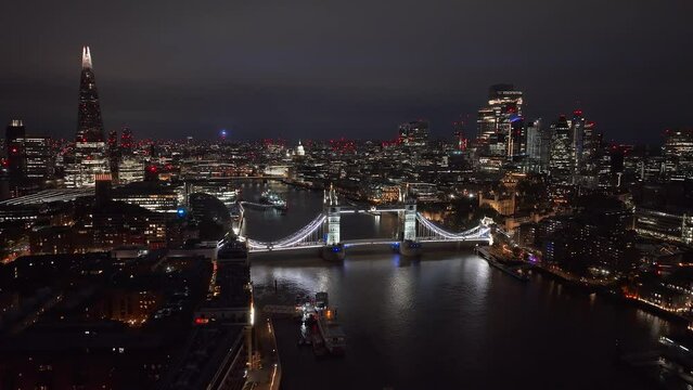 Aerial night view of the Tower Bridge in London. Beautiful illuminated panorama of London Tower Bridge.