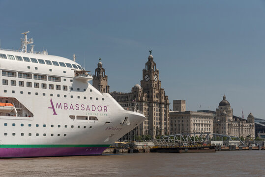 Liverpool, England, UK. June 2023.  A cruise ship berthed on the Liverpool waterfront in view of the famous Liver Building