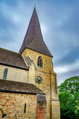 Fototapeta na wymiar Church steeple with clock in England