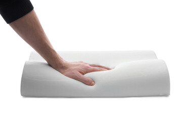 Fototapeta premium Man touching orthopedic memory foam pillow on white background, closeup