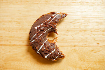 top view half eaten chocolate flavor donut horizontal composition