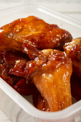 angle view honey roasted chicken wings at vertical composition