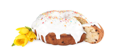 Traditional Easter cake with sprinkles and yellow tulips on white background