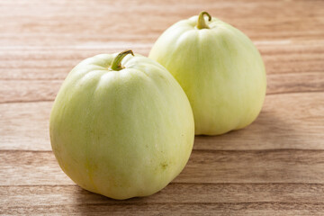 angle view muskmelons on a wood background
