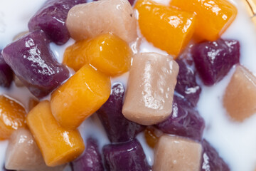 top view syrup with taro balls and milk close up