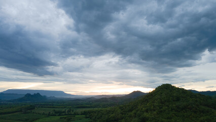 Fototapeta premium Landscape Panorama Mountain view and fields during sunset time.