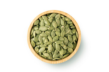Top view of Pumpkin seeds in wooden bowl on white background.
