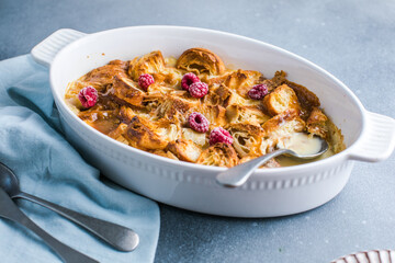 Croissant bread pudding with custard creamy sauce and vanilla ice cream very delicious dessert