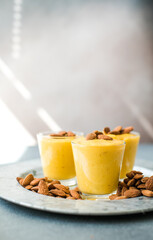 Authentic Indian cold drink made up of curd, milk malai called Lassi in saffron, kesar flavour, also called kesariya or keshariya or kesar lassi, served in  glasses