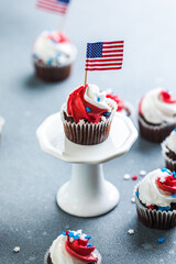Independence Day Fourth of July USA American patriotic party with american symbols. Cupcakes dessert decorated cream cheese or buttercream.
