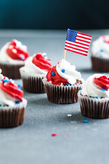 Independence Day Fourth of July USA American patriotic party with american symbols. Cupcakes dessert decorated cream cheese or buttercream.