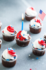 Independence Day Fourth of July USA American patriotic party with american symbols. Cupcakes dessert decorated cream cheese or buttercream.