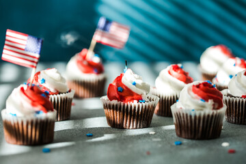Independence Day Fourth of July USA American patriotic party with american symbols. Cupcakes dessert decorated cream cheese or buttercream.