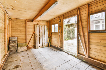 Fototapeta premium an empty room with wooden walls and wood trim around the door, which has been stripped down to make way for new flooring