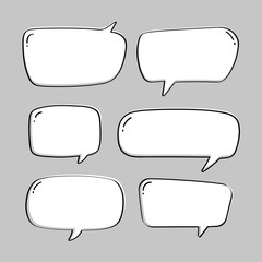 Set of hand-drawn speech bubbles on a gray background. Talking bubble symbol in doodle style.