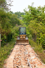 A bulldozer under construction at a field construction site