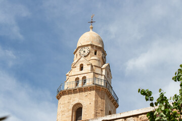 Fototapeta na wymiar The Bell Tower of the Abbey of Dormition on Mount Zion. The old city of Jerusalem.
