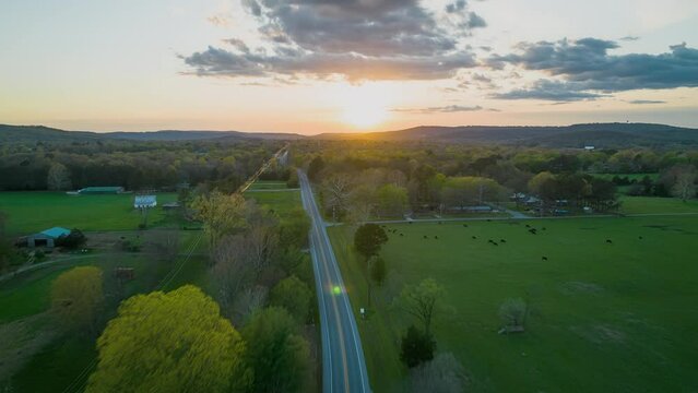 Sun sets of Northwest Arkansas fields darm and country highway near Lake Sequoyah - Hyperlapse