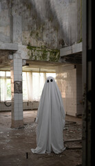 Ghost in a white sheet walking through an abandoned building